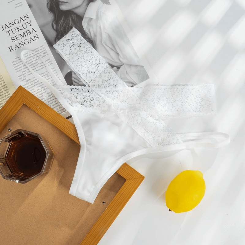 Sexy white lace women's thong with breathable cutouts for a flirty, comfortable fit, perfect for any wardrobe. Style SF0987.